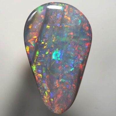 SOLID SEMI BLACK OPAL Sparkling bright red over green, Banded pattern. SEE VIDEO